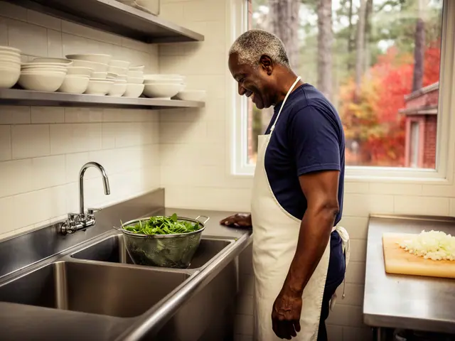 A man with short gray hair beside new equipment in a small barbecue restaurant.